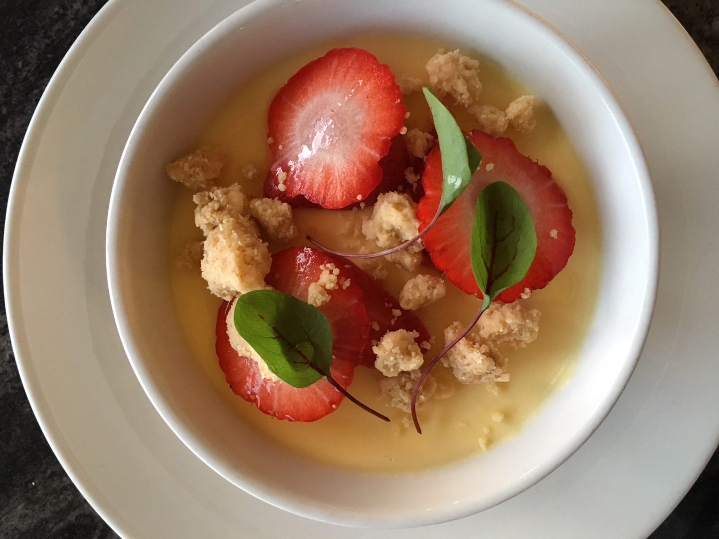 Panacotta with strawberries and hazelnut crumbs