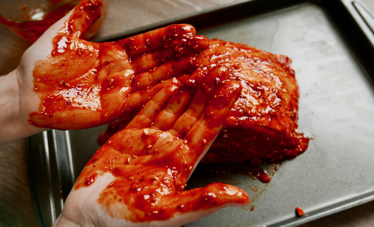 It's best to use your hands to rub the Korean marinade into the Welsh Lamb