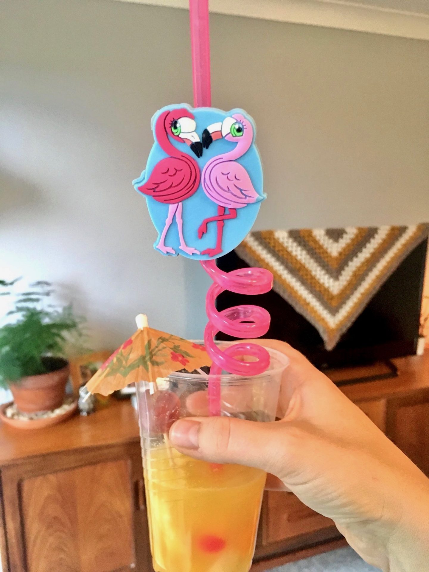 Retro party punch with umbrella and straw