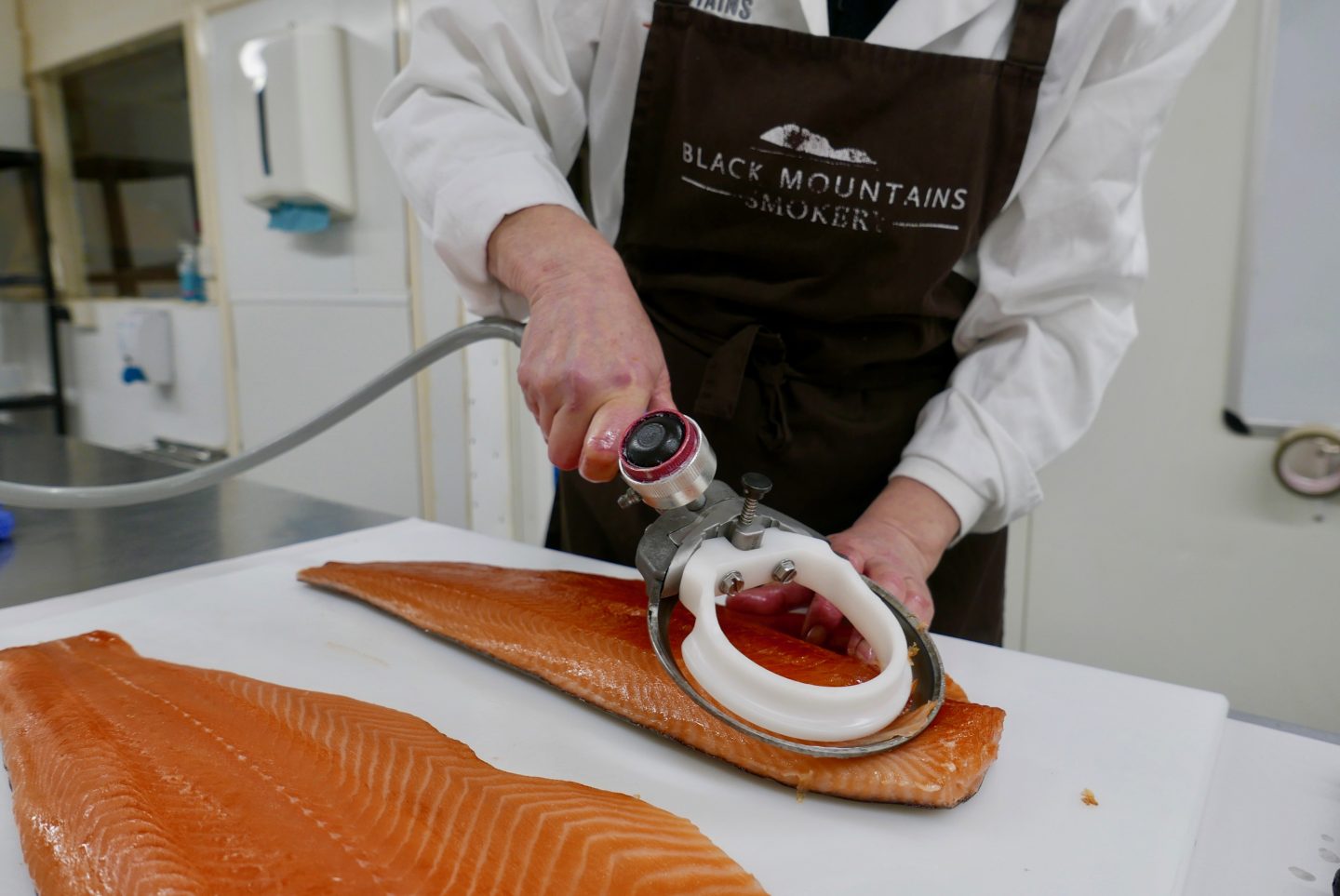 Trimming the smoked salmon