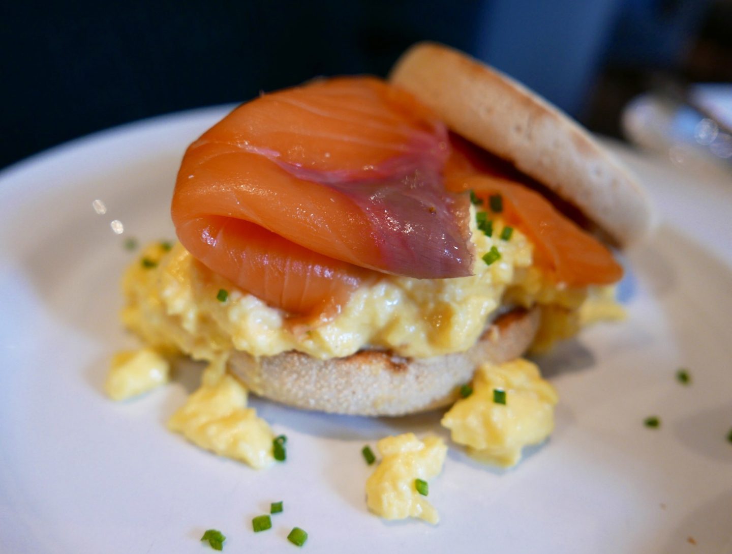 Smoked salmon and scrambled eggs on a muffin