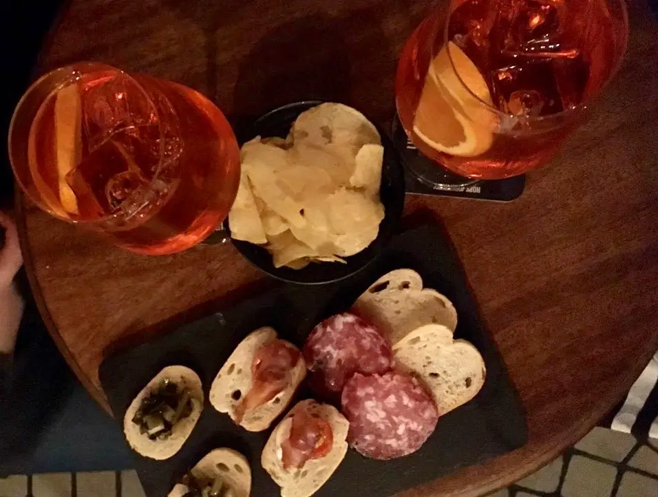 Aperol Spritz and aperitif selection at Ca Del Fasa bar in Bergamo