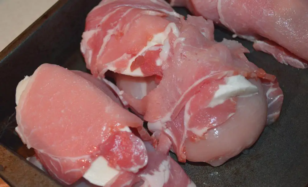 mozzarella and bacon wrapped chicken ready for the oven