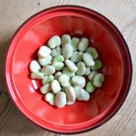 A side dish of broad beans & spring onions