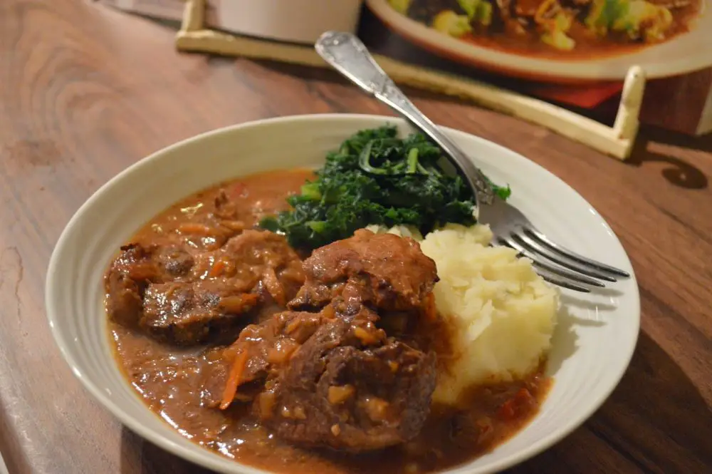 Ready to eat, slow cooked pork with star anise and orange.