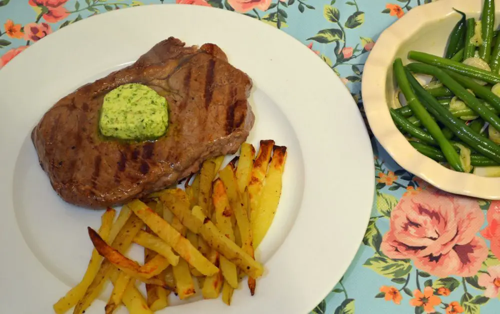 Steak with garlic and herb butter and home made french fries