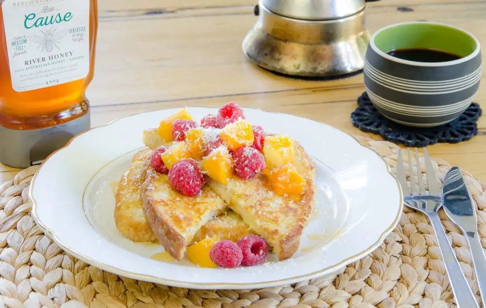 Coconut french toast with apricots, raspberries and honey