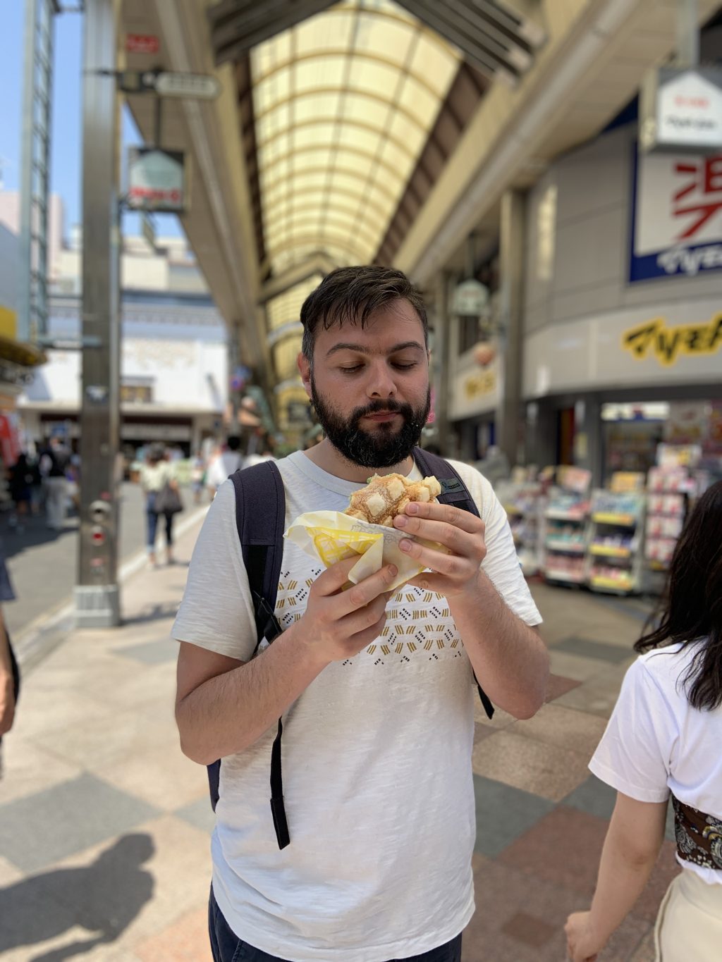 Dave tucking into a delicious melon pan ice cream roll