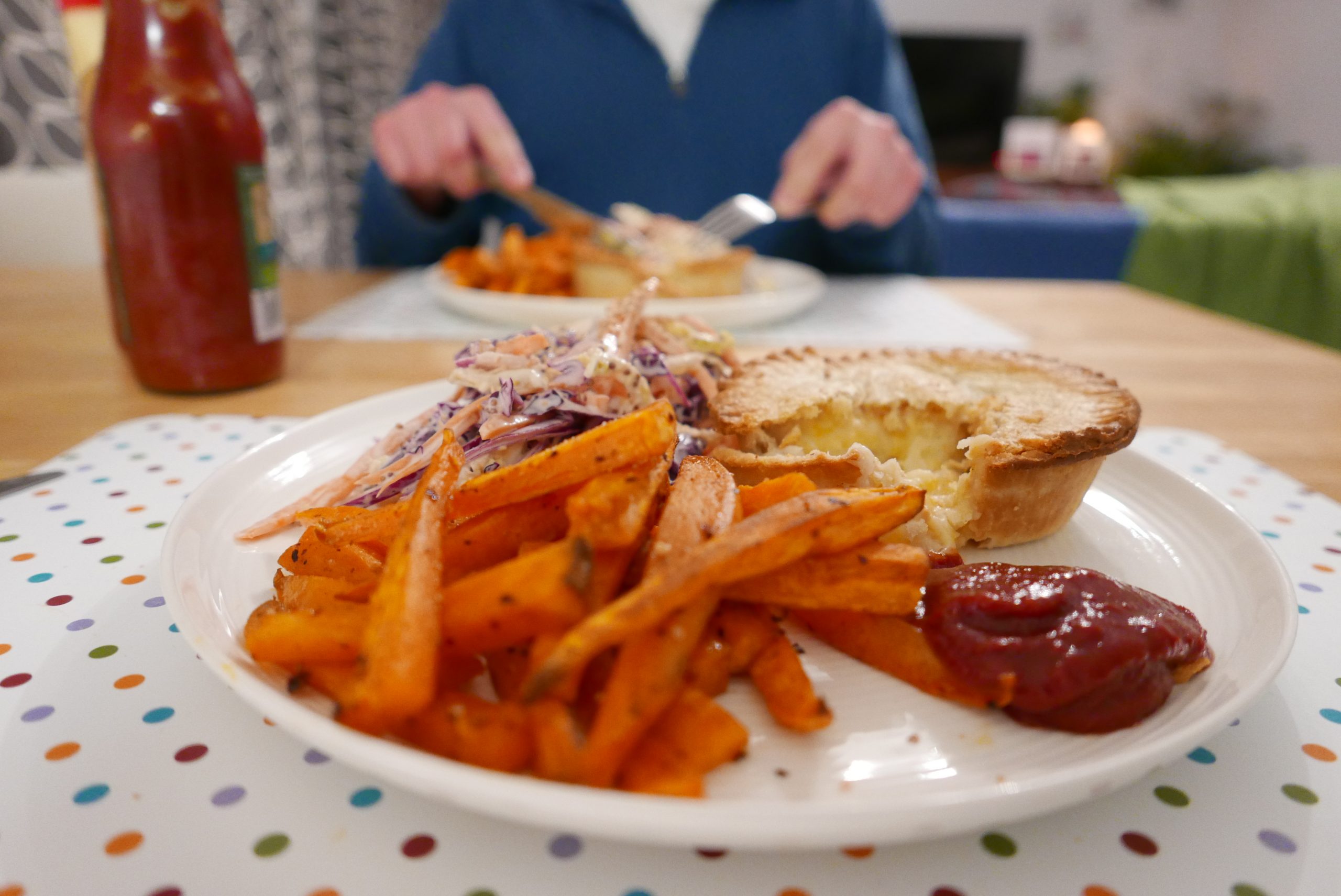 Tasty cheese and onion pie with ketchup and sweet potato fries