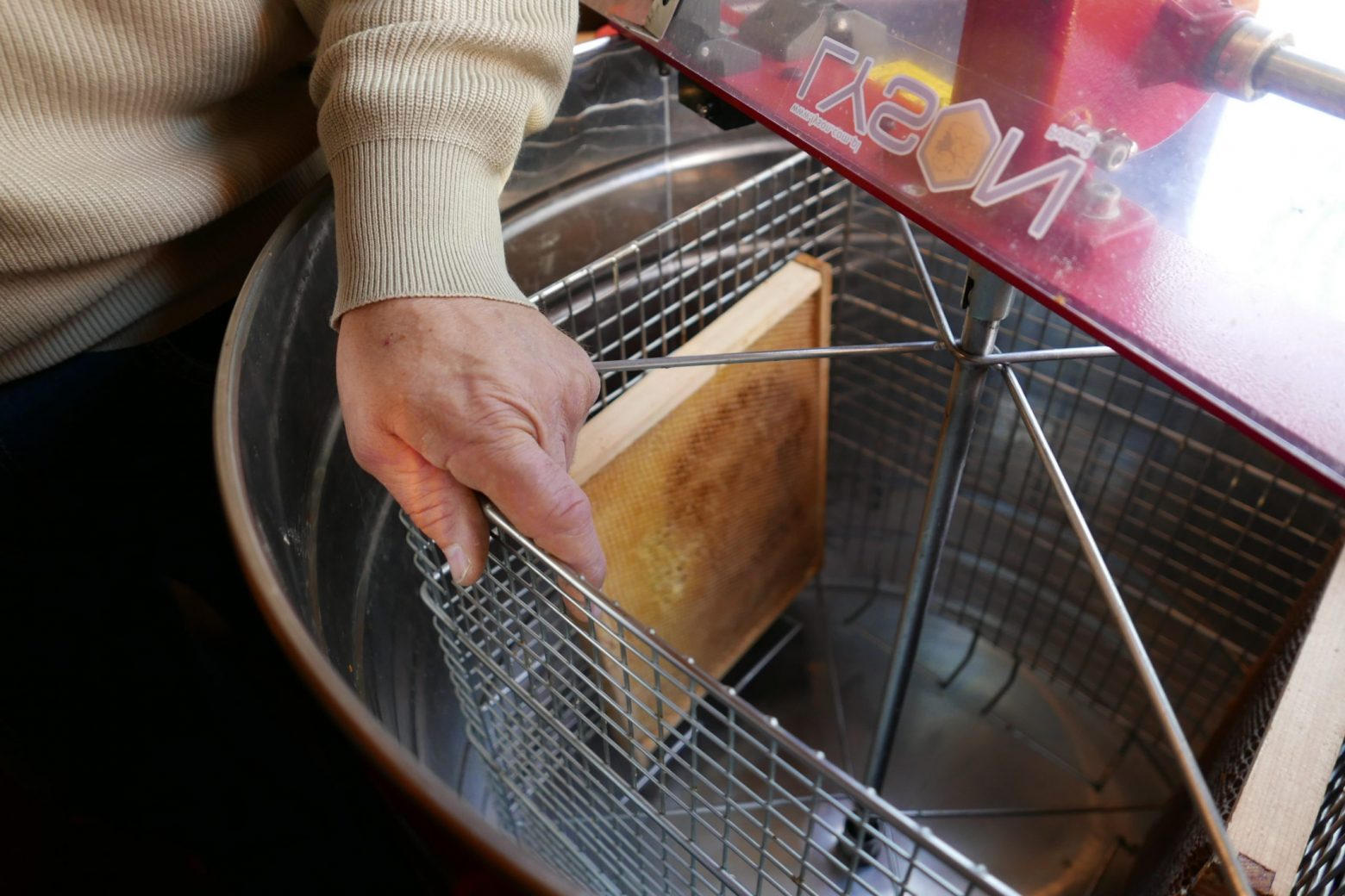 Demonstrating how to use the Honey Extractor