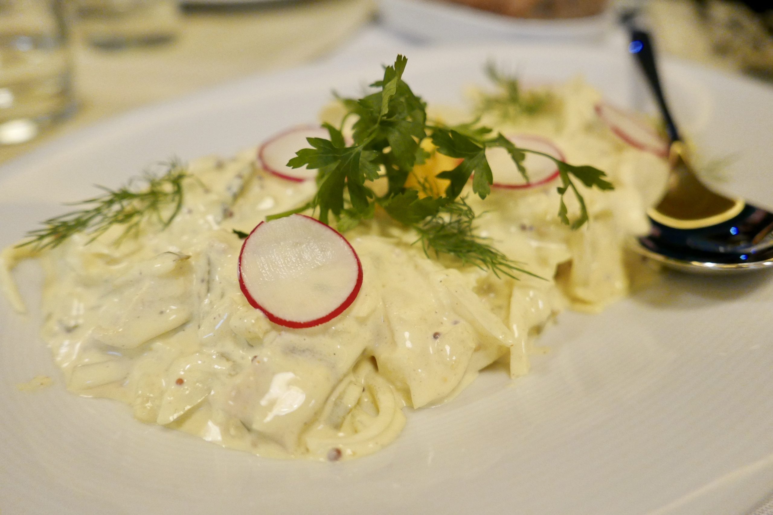 Herring with sour cream, sorrel and onion