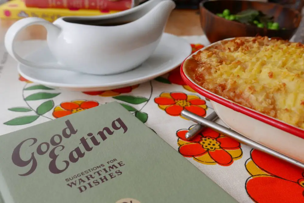 Sausage pie and gravy with a copy of a wartime cookbook