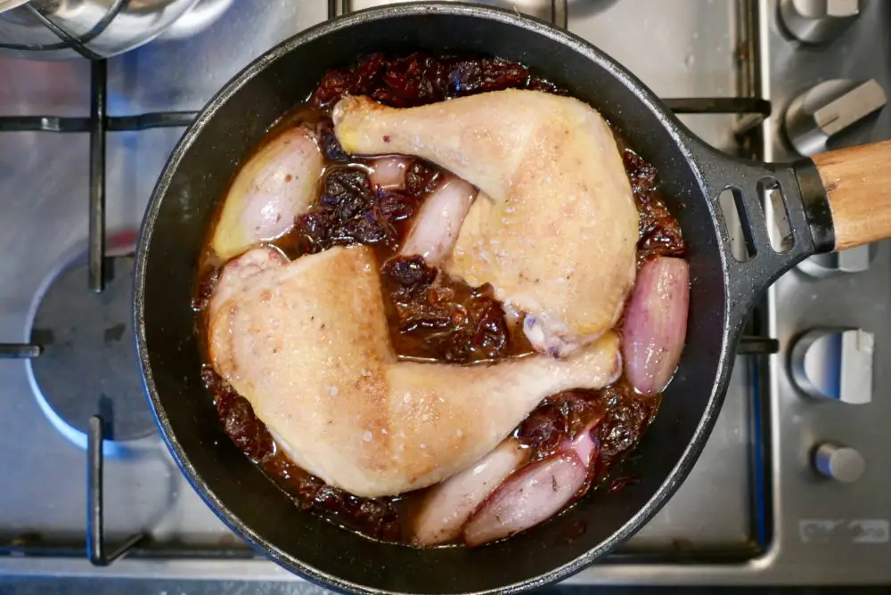 Chicken legs with prunes and red wine ready to go into the oven