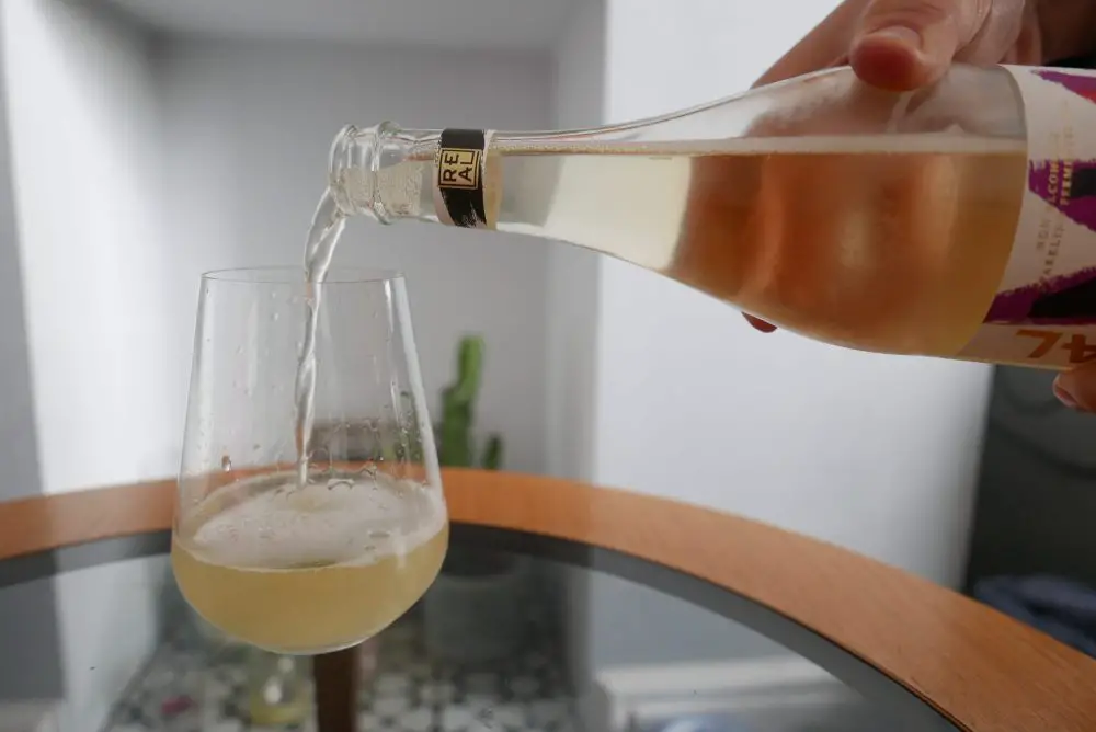 Pouring kombucha into a glass