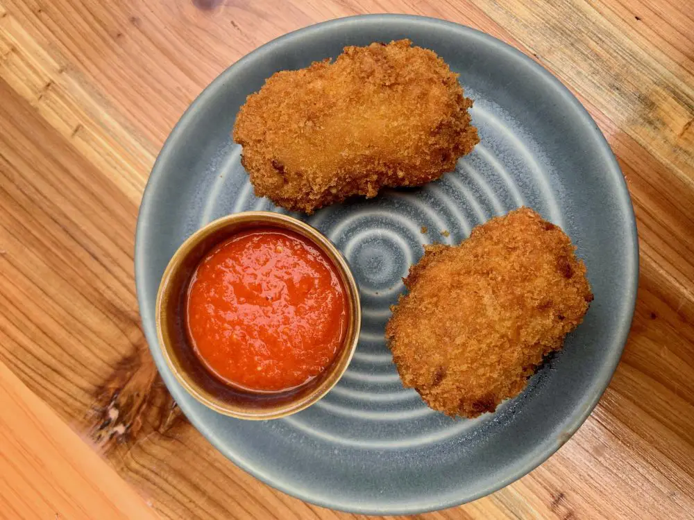 Awaze croquettes with red pepper chilli sauce