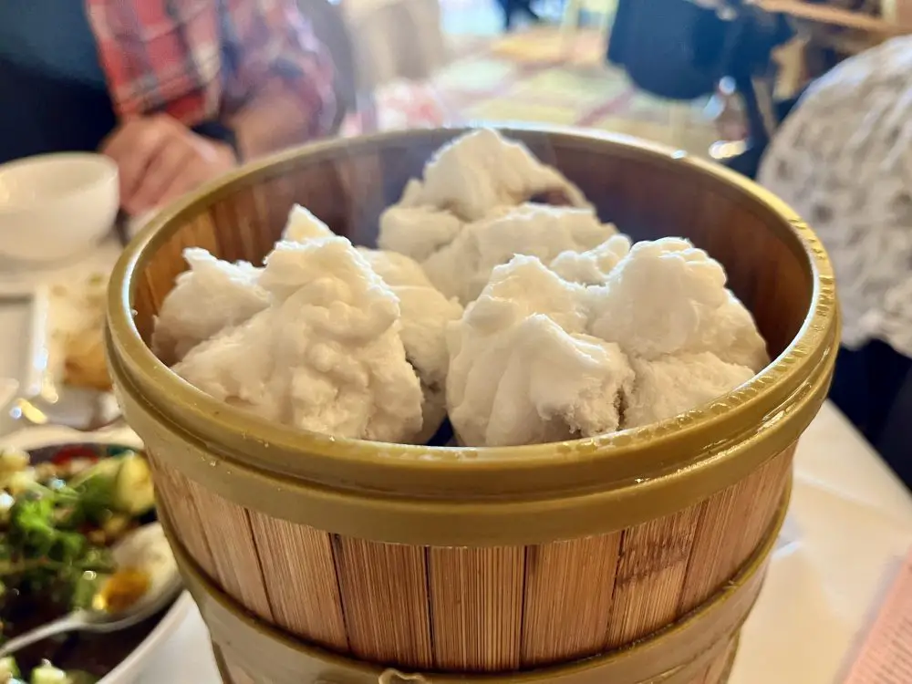 A basket of fluffy steamed bbq pork buns