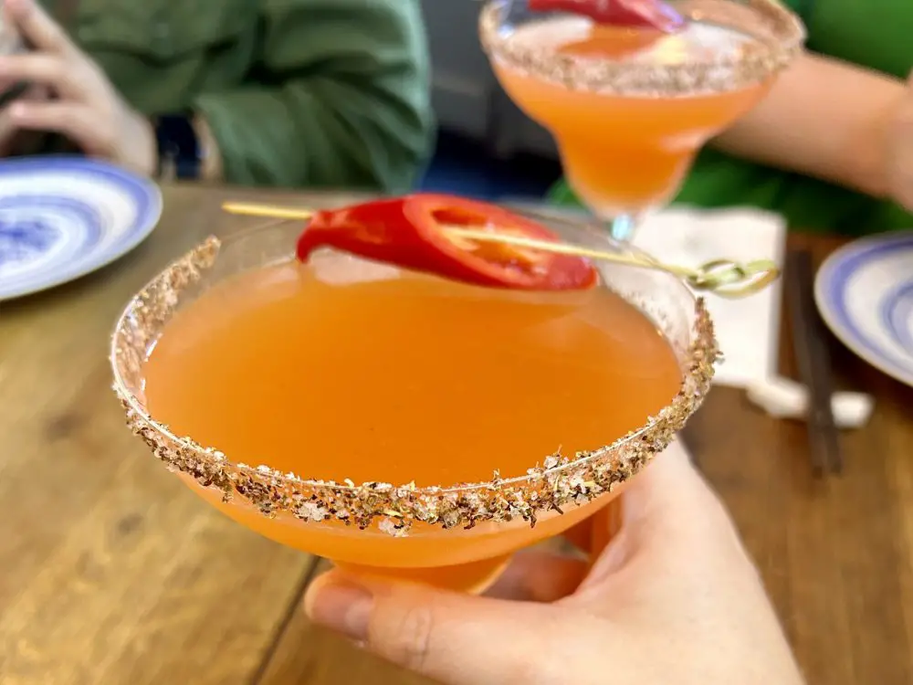 Spicy Margherita with a mala chilli rim and red chilli garnish