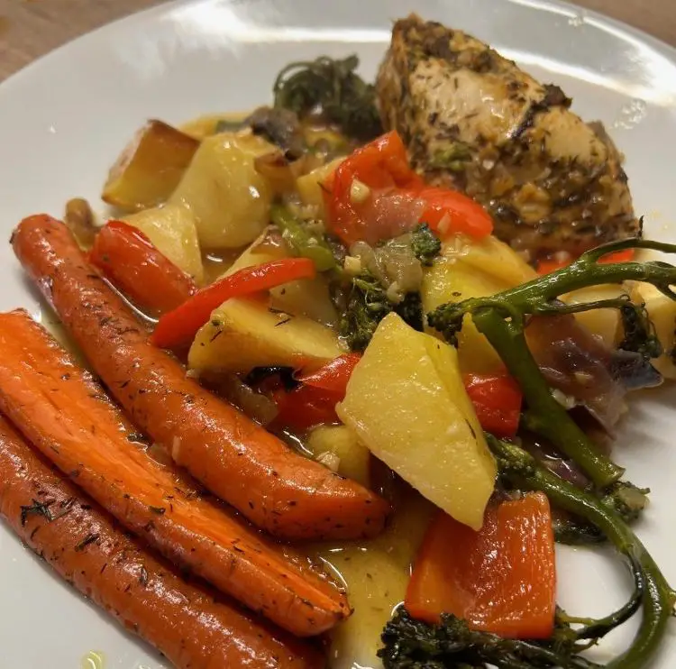 Mum's lime chicken tray bake with whole roast carrots, plated up and ready to eat