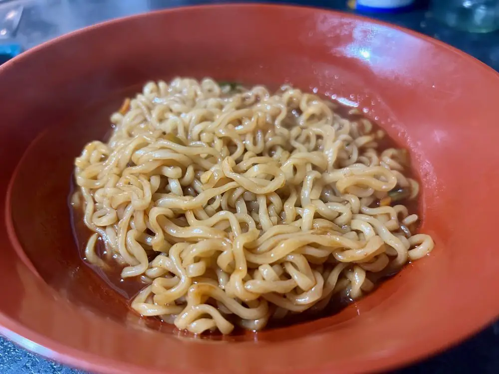 Buldak spicy noodles in a red bowl