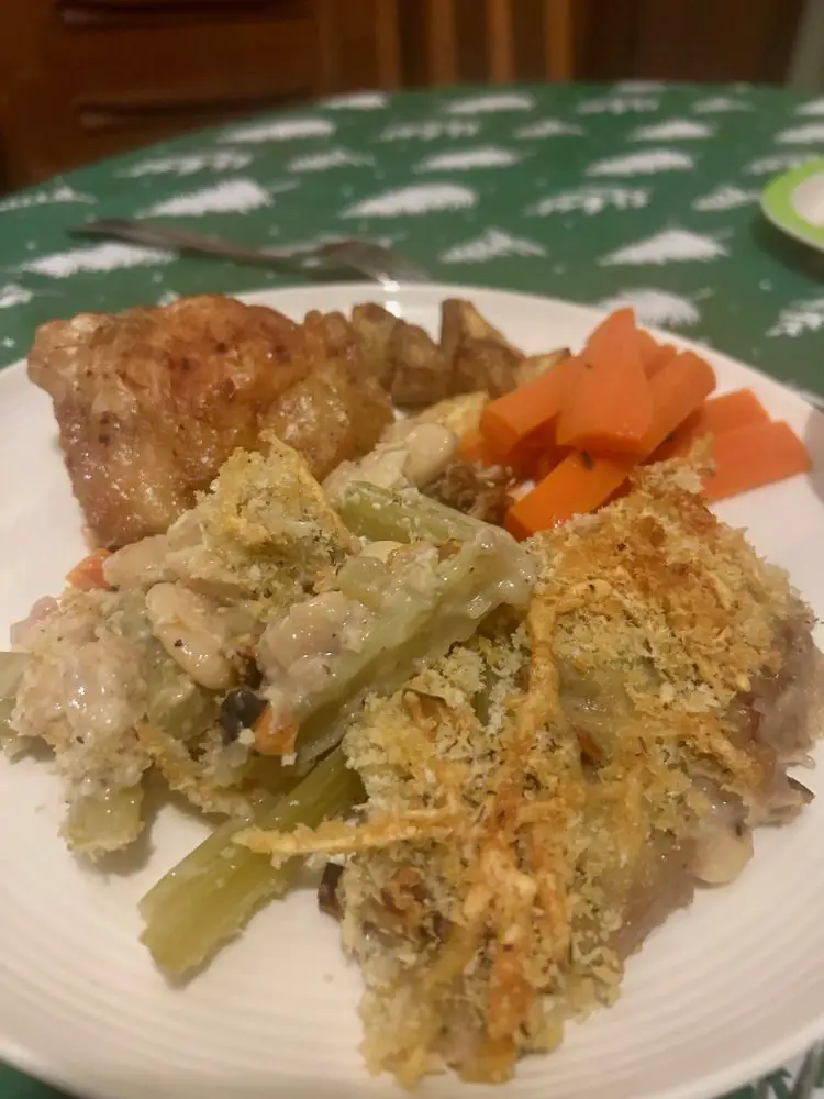 Celery and white bean cassoulet with carrots, roasted chicken thighs and crispy potatoes