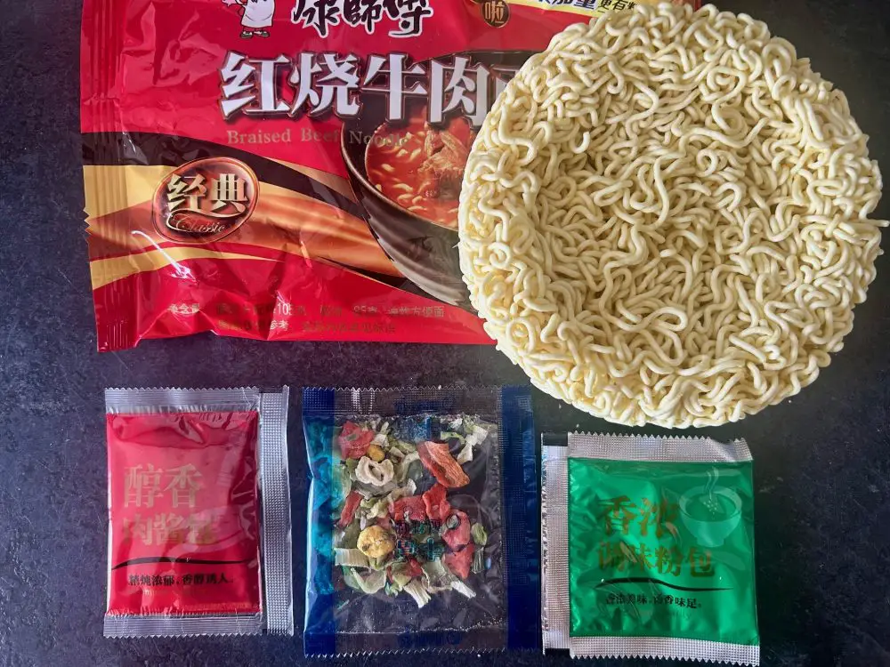 Master Kong braised beef noodles packet and inside contents