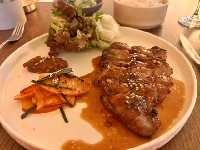 Pork collar marinaded in doenjang served with lettuce wraps and an apple kimchi