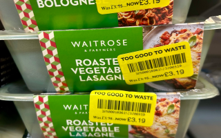 Yellow stickers on a pile of ready meals in Waitrose